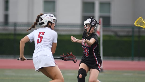 Alexandra Leary, left, scores one of her four goals to guide Lake Highland Prep to an 18-2 victory over Edgewood in the Region 2-1A final.